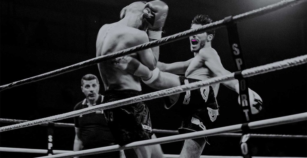 Kick boxer wearing Hot Purple Neomorph mouthguard