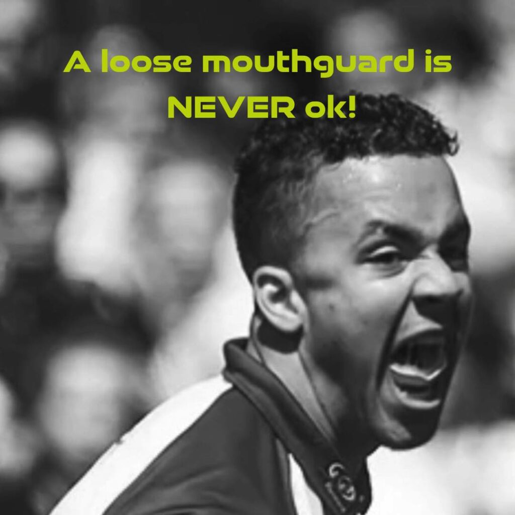 A loose mouthguard falling from a sports persons upper jaw. better fitting mouthguard is a must.