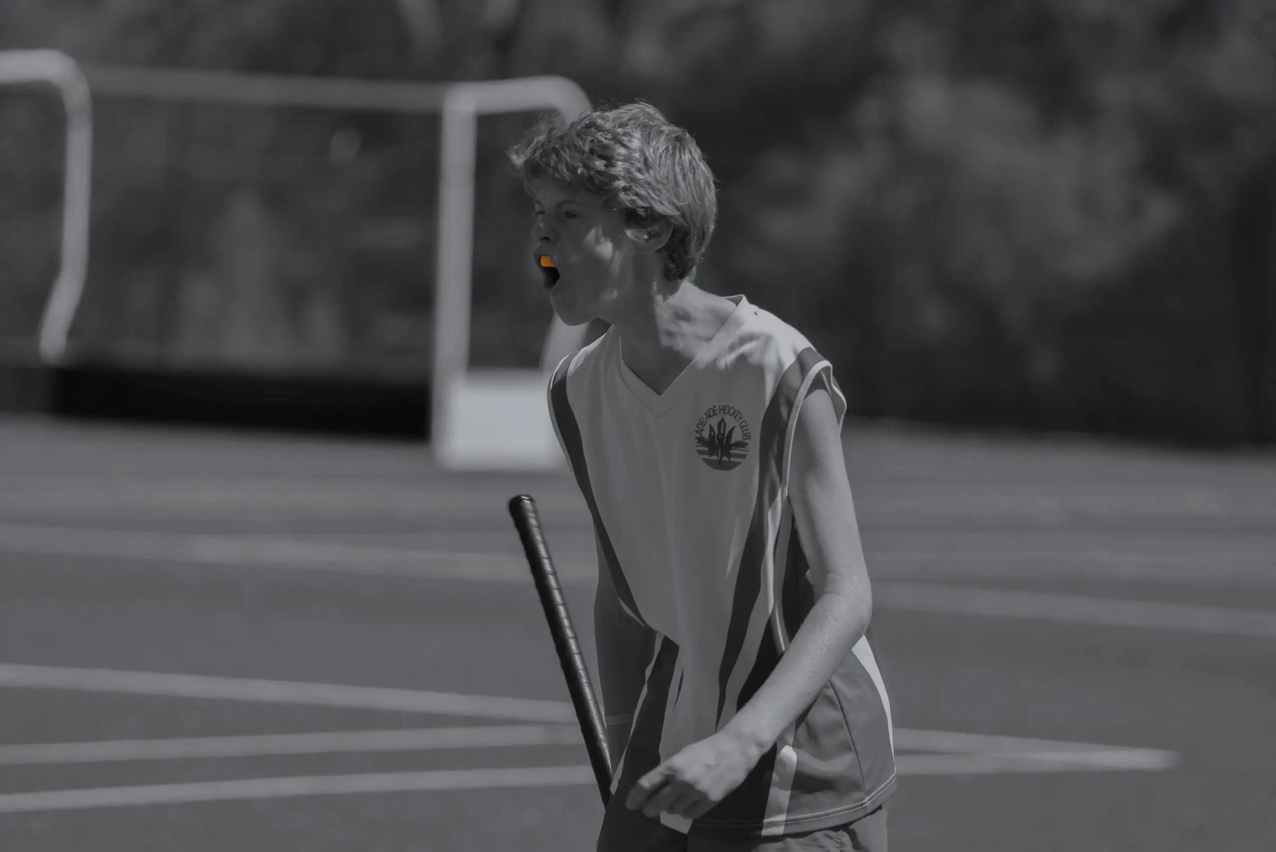 Male Hockey player wearing an Orange Neomorph Mouthguard