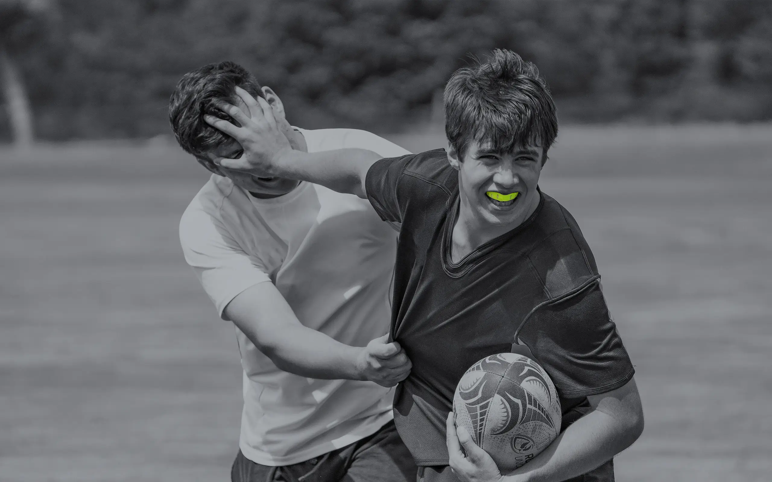 Young rugby sports person wearing lime green Neomorph Mouthguard