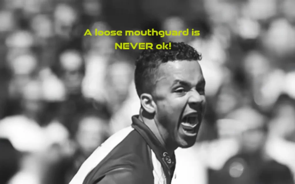 An image of a sportsperson with a dangerously loose mouthguard. There is a caption 'A Loose Mouthguard is never ok.