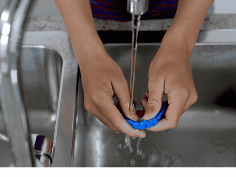 rinsing mouthguard under tap