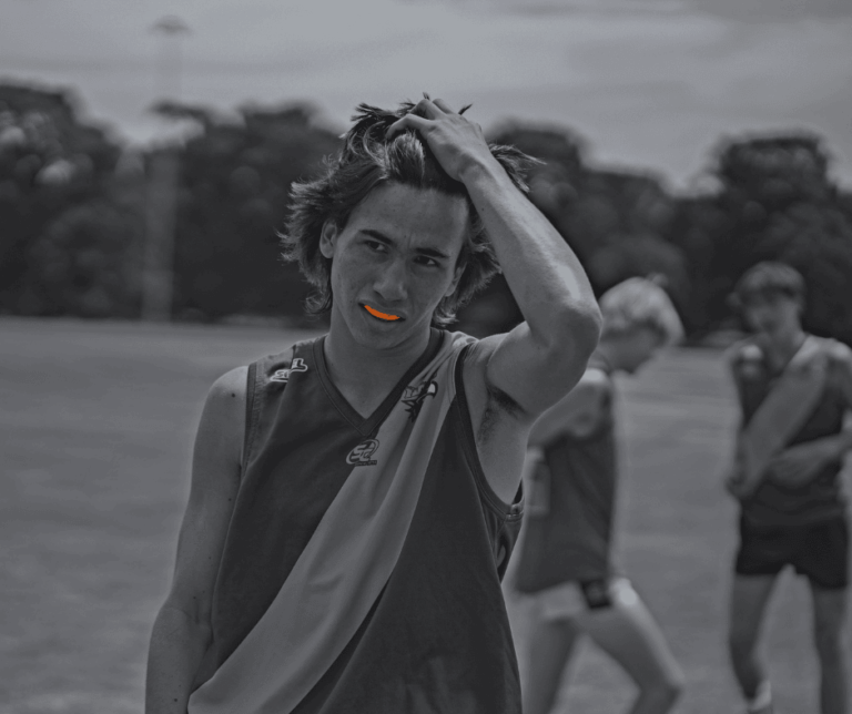 Teenager footballer wearing Orange Neomorph Mouthguard